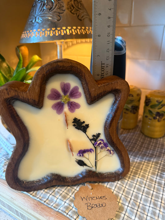 Witches Brew Ghost Wood Bowl Candle (large purple flower with black and purple small stems)